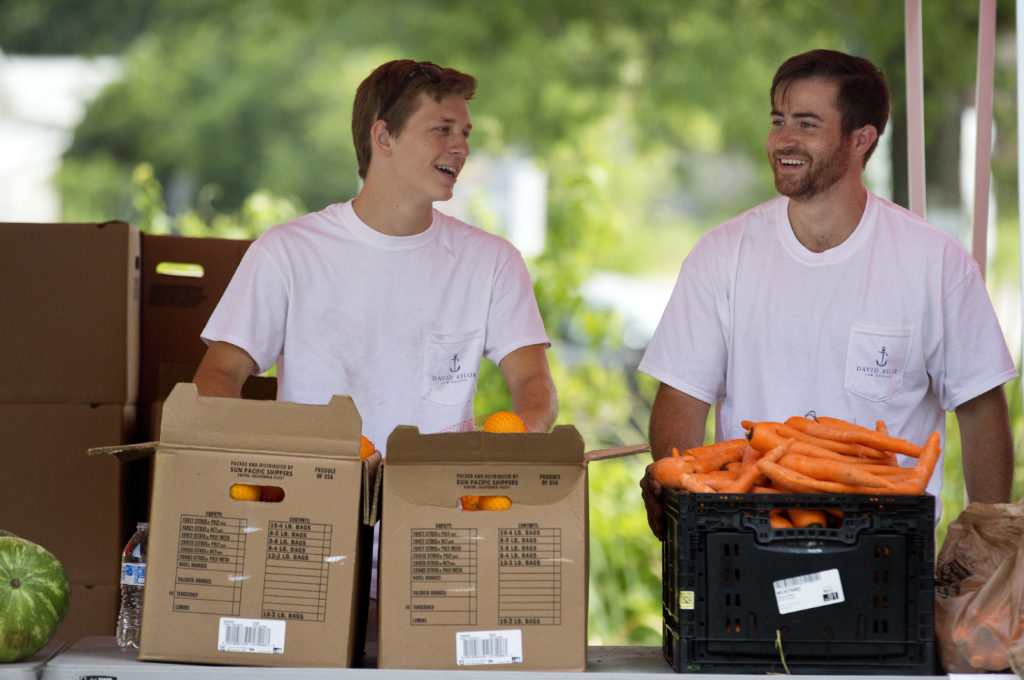 Volunteers load fresh food at the Lowcountry Food Bank, meeting urgent needs in South Carolina.