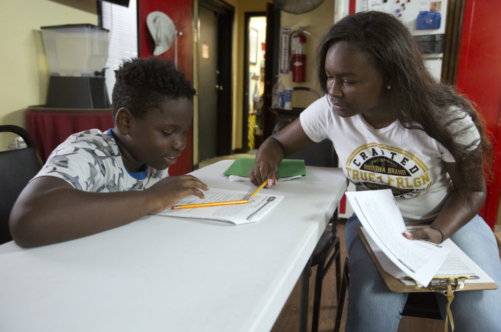 Student and mom work on homework together